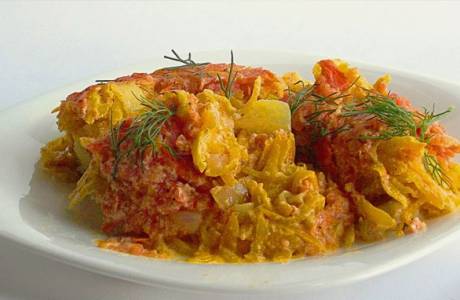 Pollock with carrots and onions in the oven