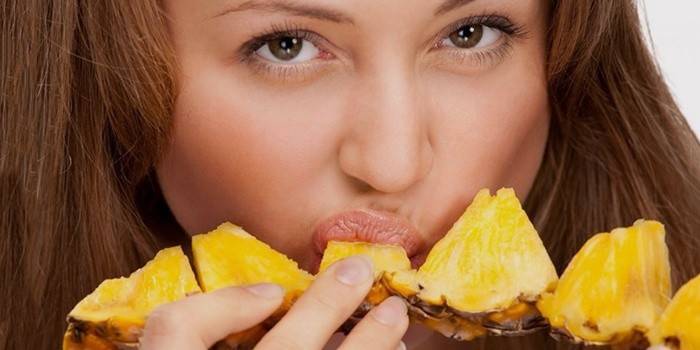 Girl eating pineapple for weight loss.