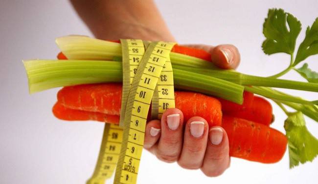 Carrots and celery in hand
