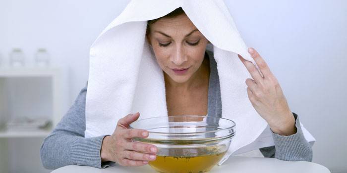 Woman doing inhalation