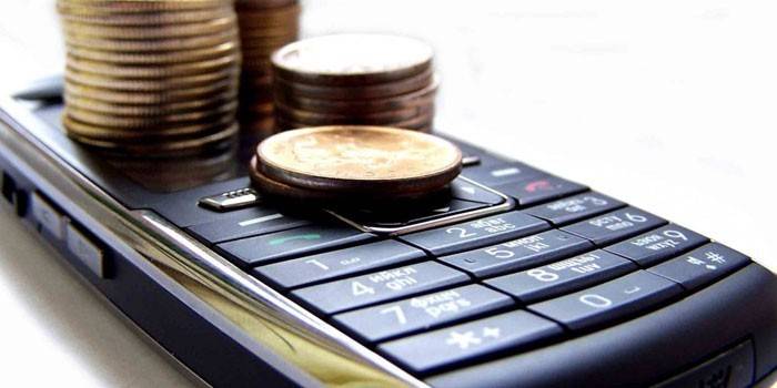 Telefone móvel e moedas