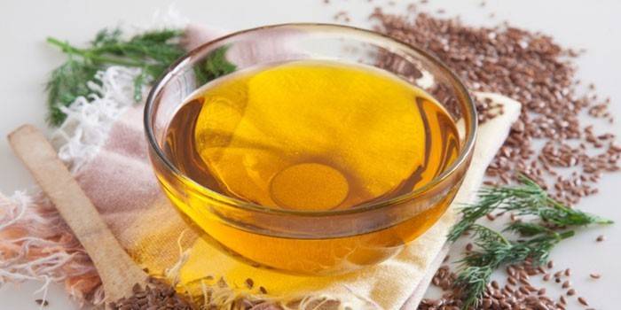Linų sėmenų aliejus stikliniame inde