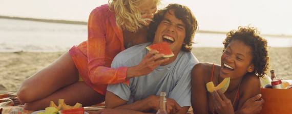 Two girls and a guy on the beach