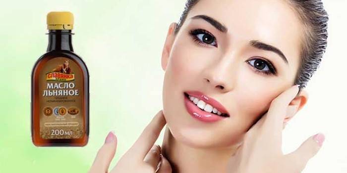 Ragazza e una bottiglia con olio