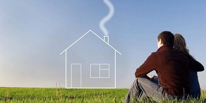 Couple dans la nature et une maison imaginaire