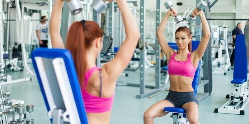 Girl is training in the gym